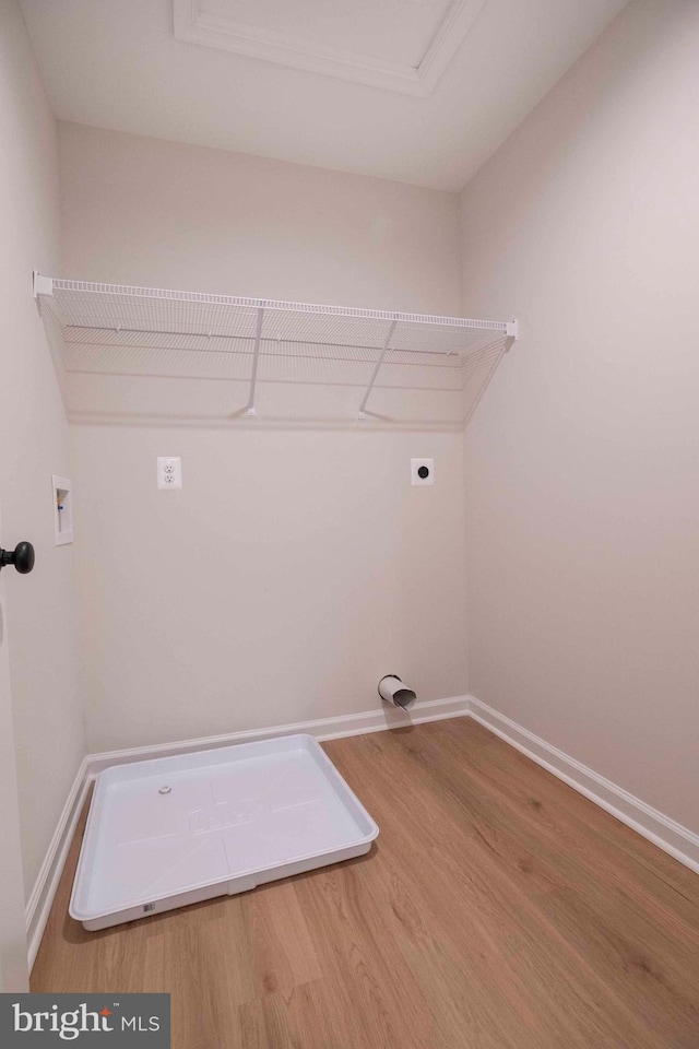 washroom featuring washer hookup, wood-type flooring, and hookup for an electric dryer