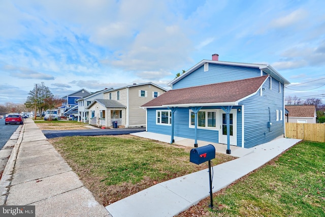 view of front of home with a front lawn