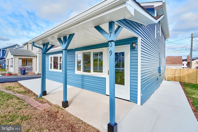 view of side of property featuring a porch