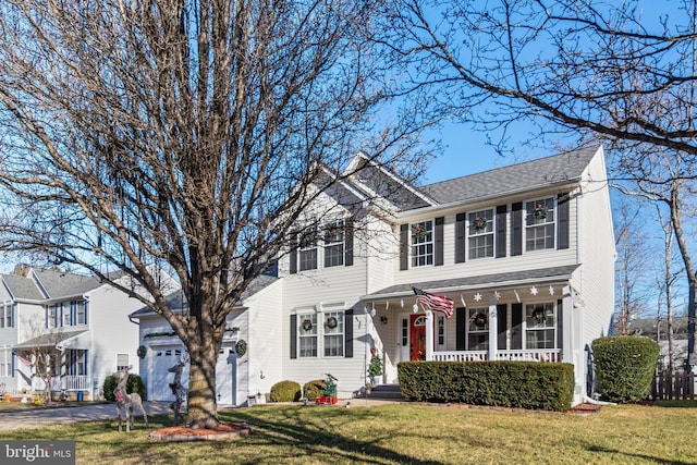 colonial home featuring a porch and a front yard