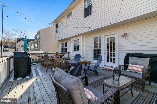 wooden deck with area for grilling