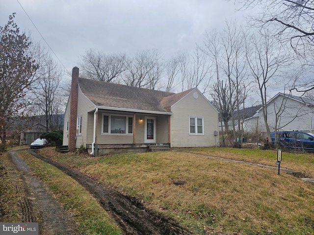 bungalow-style house with a front lawn