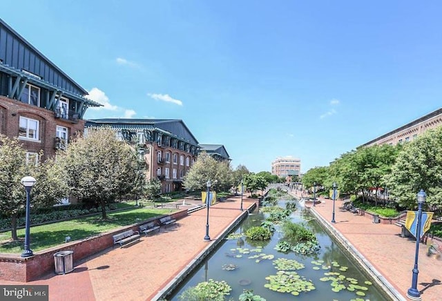 view of community with a water view