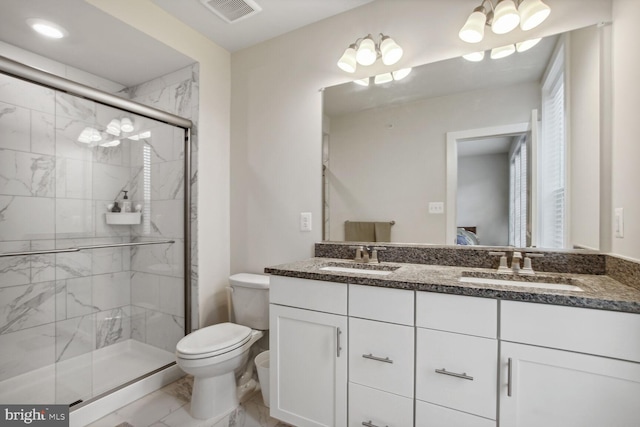 bathroom featuring walk in shower, vanity, and toilet