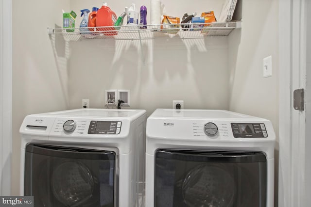 washroom with washing machine and dryer