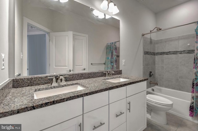 full bathroom featuring vanity, tile patterned flooring, shower / bath combo with shower curtain, and toilet