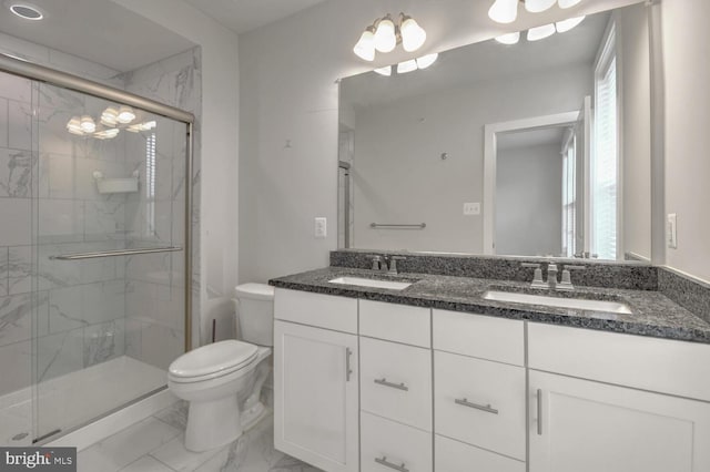 bathroom with toilet, an enclosed shower, and vanity