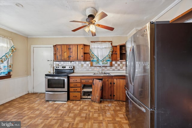 kitchen with tasteful backsplash, sink, light parquet floors, and stainless steel appliances