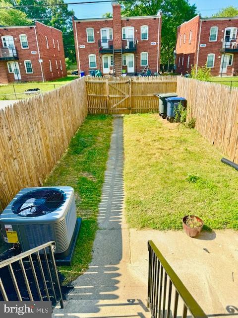 view of yard featuring central AC unit