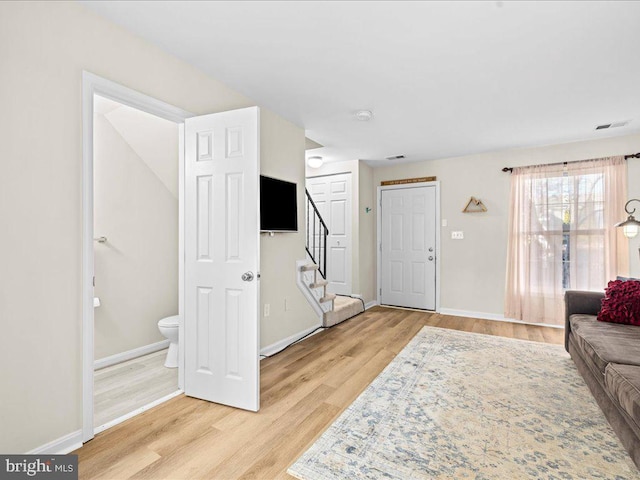 living room with light hardwood / wood-style floors