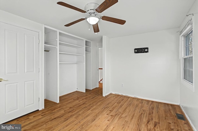 unfurnished bedroom featuring ceiling fan and light wood-type flooring