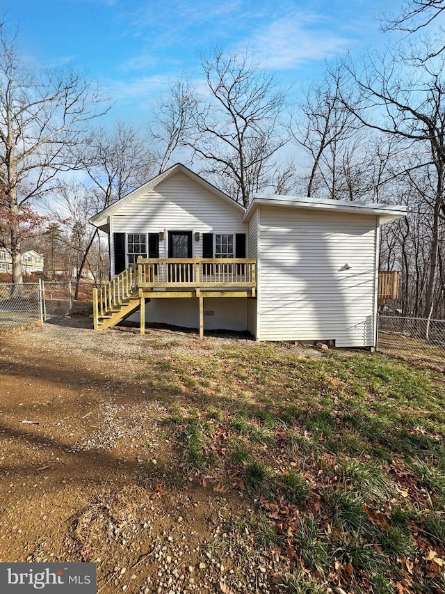 view of front facade featuring a wooden deck