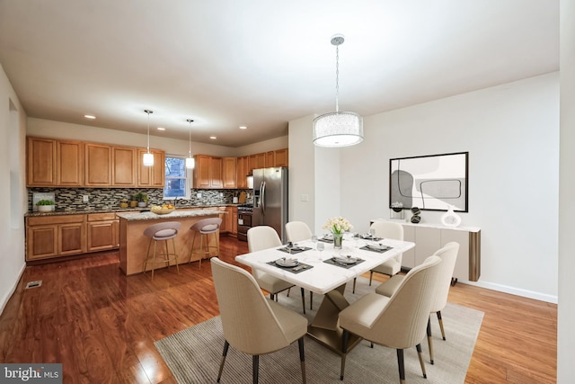 dining room with dark hardwood / wood-style floors