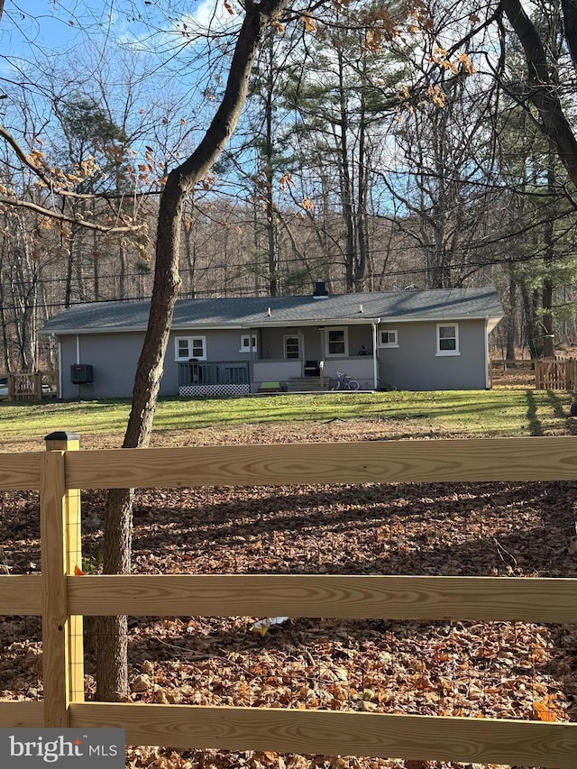 rear view of house with a lawn