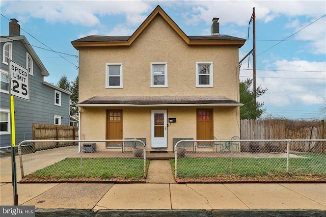 view of front of property with a front lawn and a porch