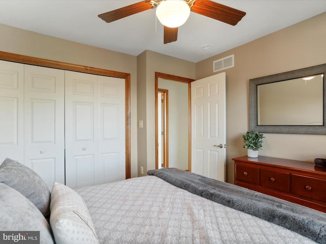 bedroom featuring ceiling fan and a closet