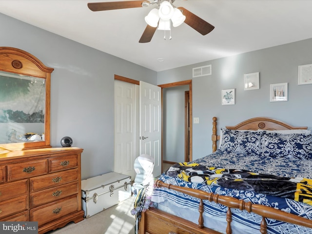 bedroom featuring ceiling fan and light colored carpet