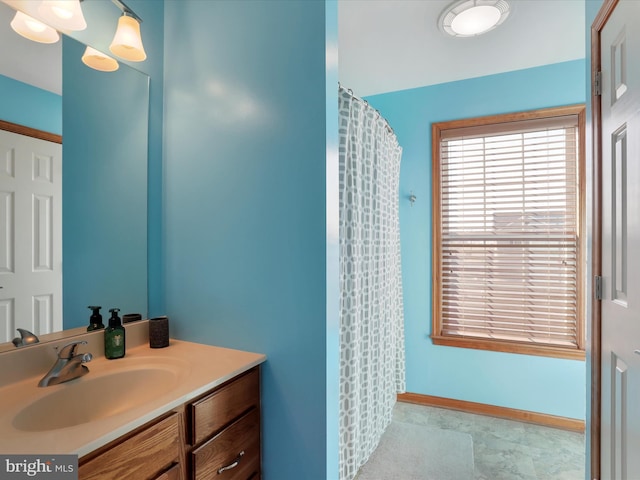 bathroom with vanity and walk in shower