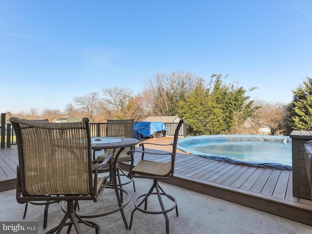 deck with a covered pool