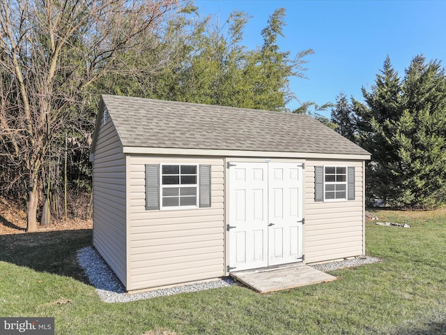 view of outdoor structure featuring a yard