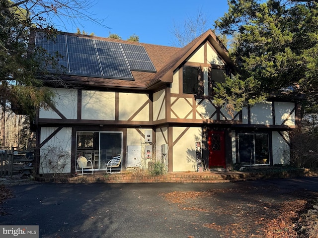 view of front of house with solar panels