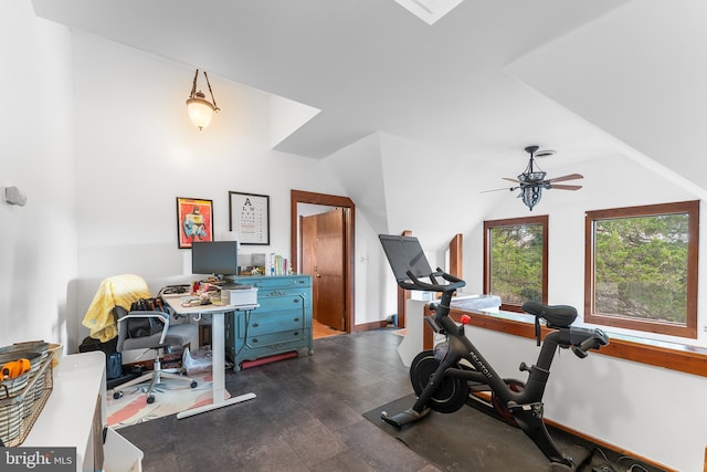 workout area featuring dark hardwood / wood-style floors and ceiling fan