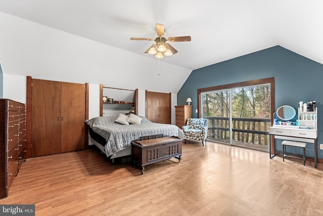 bedroom with light hardwood / wood-style floors, vaulted ceiling, and ceiling fan