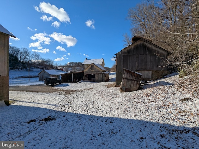 snowy yard with an outdoor structure