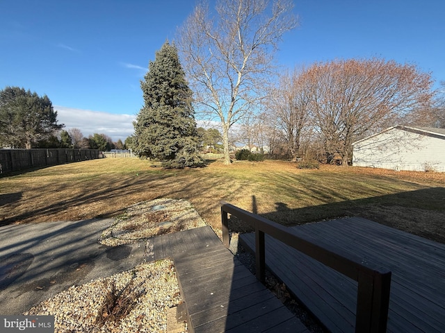 view of yard with a wooden deck