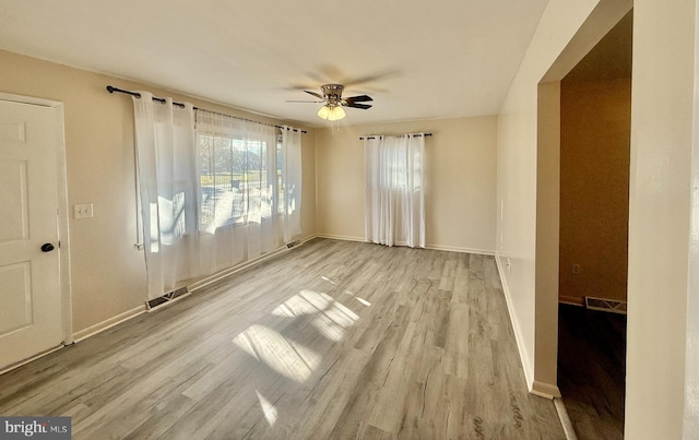 unfurnished room featuring ceiling fan and light wood-type flooring