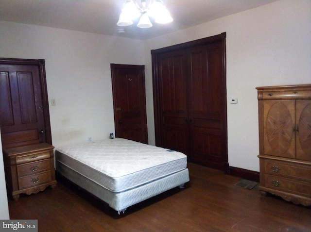 bedroom featuring dark hardwood / wood-style floors and ceiling fan