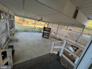 miscellaneous room featuring a healthy amount of sunlight and concrete floors