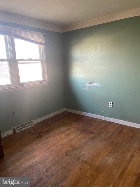 empty room featuring hardwood / wood-style floors