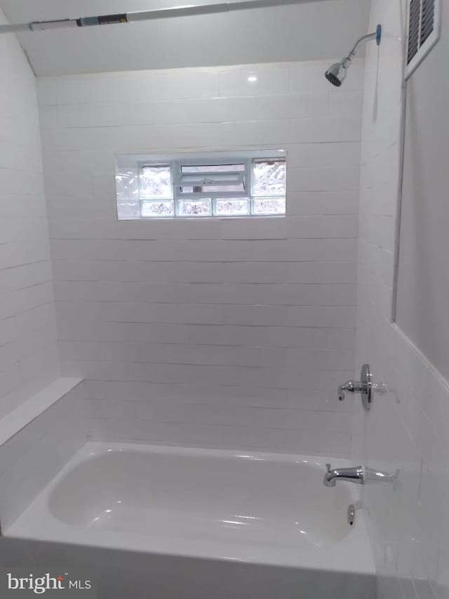 bathroom with visible vents and tub / shower combination