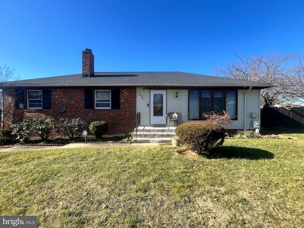 ranch-style home with a front yard