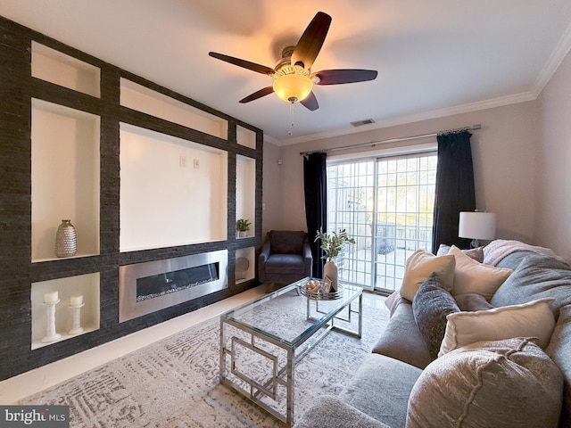 living room featuring ceiling fan and ornamental molding