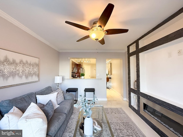 living room with ceiling fan and crown molding