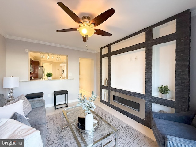 living room with ceiling fan and crown molding