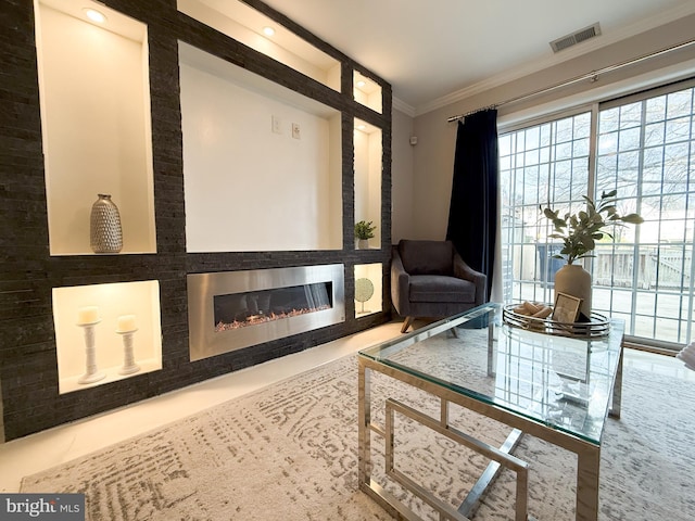 interior space with ornamental molding and a fireplace