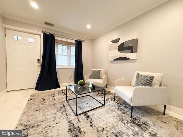 sitting room featuring ornamental molding