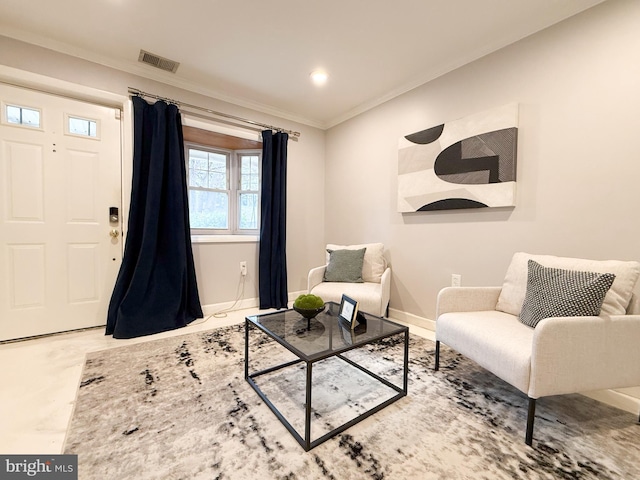 living area featuring crown molding