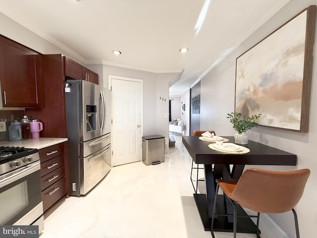 kitchen featuring range with gas stovetop, stainless steel fridge, and ornamental molding