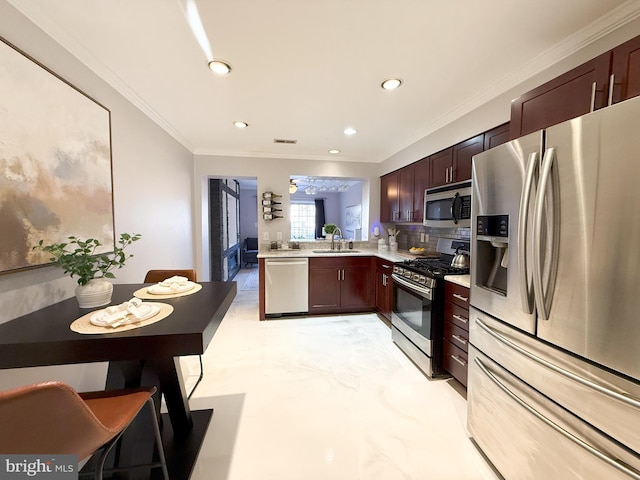 kitchen featuring crown molding, sink, tasteful backsplash, kitchen peninsula, and stainless steel appliances