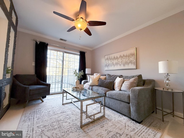 living room featuring ceiling fan and crown molding