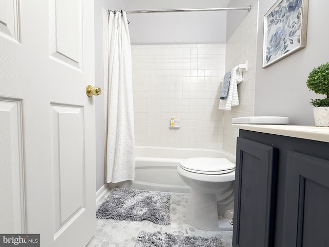 full bathroom featuring tile patterned flooring, vanity, toilet, and shower / bathtub combination with curtain