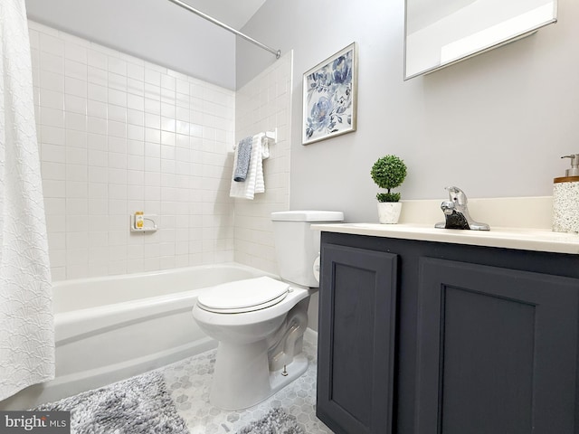 full bathroom with tile patterned floors, vanity, shower / tub combo, and toilet