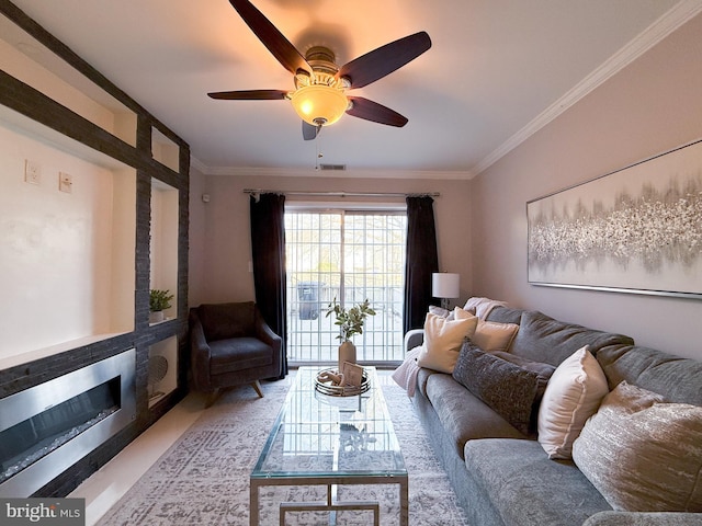 living room with ceiling fan and crown molding