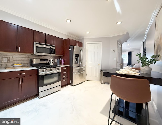 kitchen featuring decorative backsplash, crown molding, and appliances with stainless steel finishes