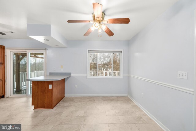 kitchen with ceiling fan and kitchen peninsula