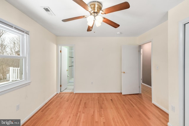 unfurnished bedroom with ceiling fan, connected bathroom, and light hardwood / wood-style flooring